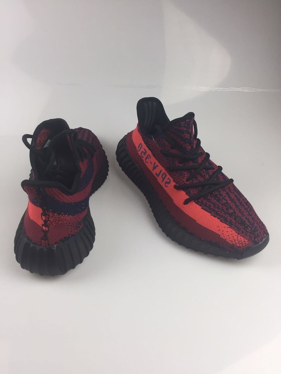Adidas Yeezy Boost 350 V2 Sneakers in Black and Burgundy - product image from the listing.