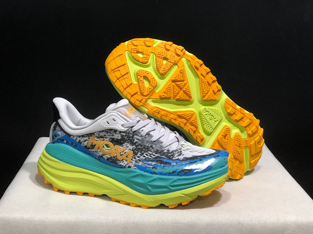 Blue and Lime HOKA Stinson 7 Trail Sneakers - product image from the listing.
