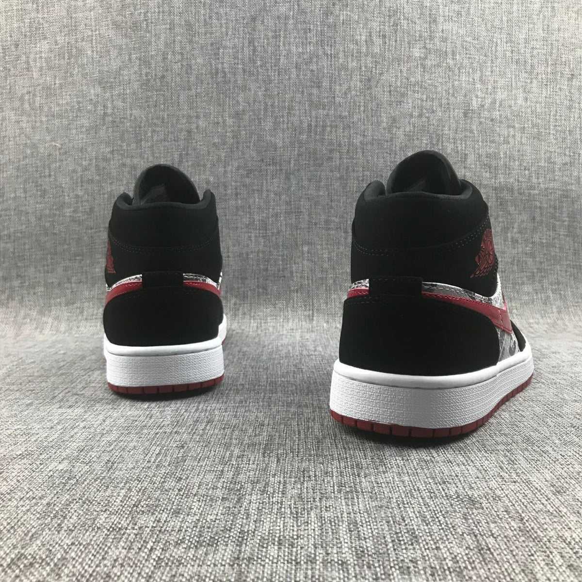 Air Jordan 1 Mid Sneakers in Black Red 852542-061 - product image from the listing.