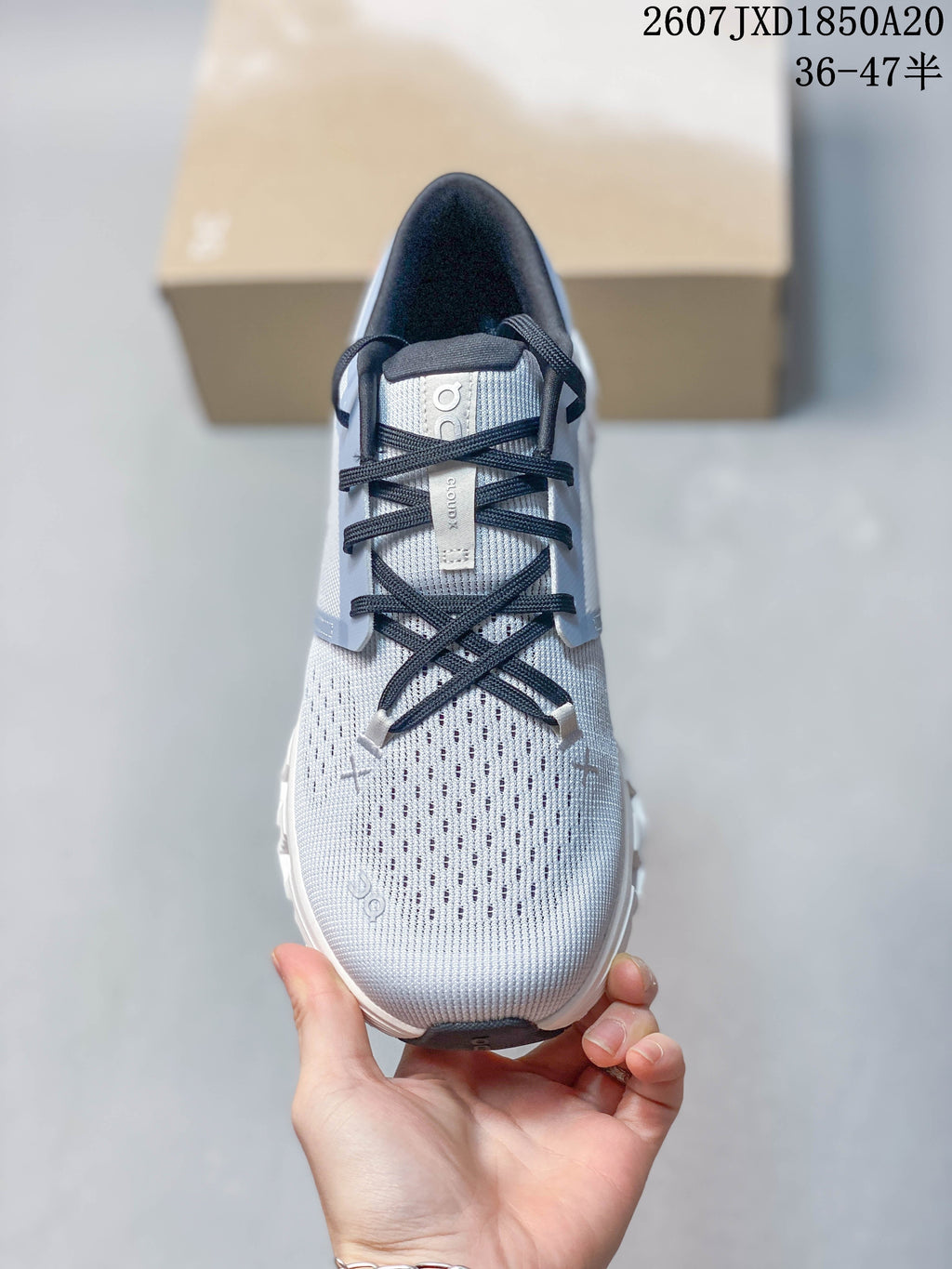 On Cloud X 4 Sneakers in Light Gray White Navy JXD1850A20 - product image from the listing.