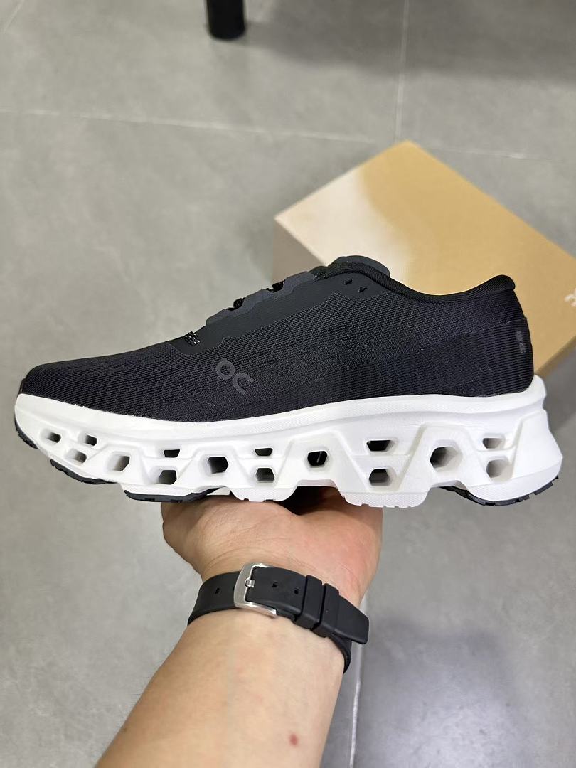 On Running Black and White Road Sneakers for Running - product image from the listing.