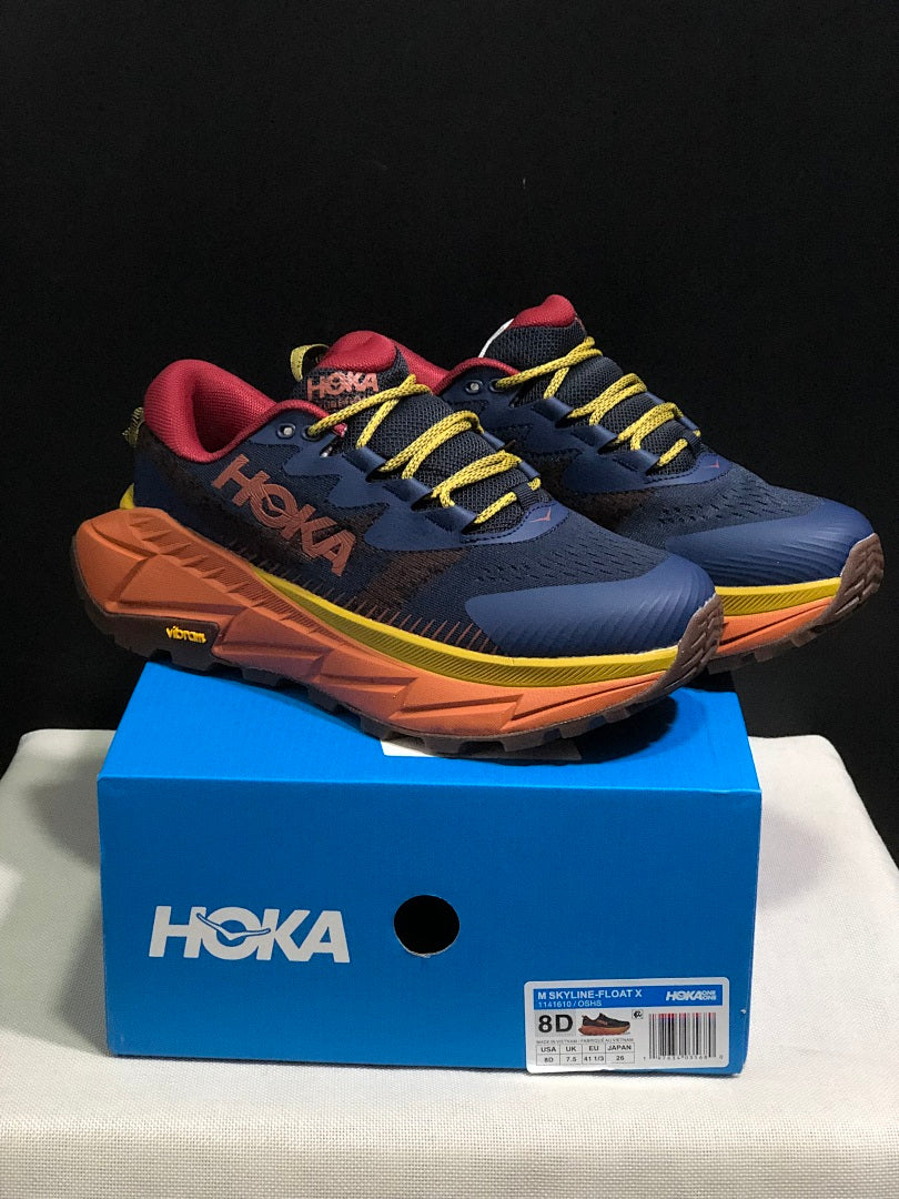 HOKA Skyline Float X Trail Sneakers in Navy Orange - product image from the listing.