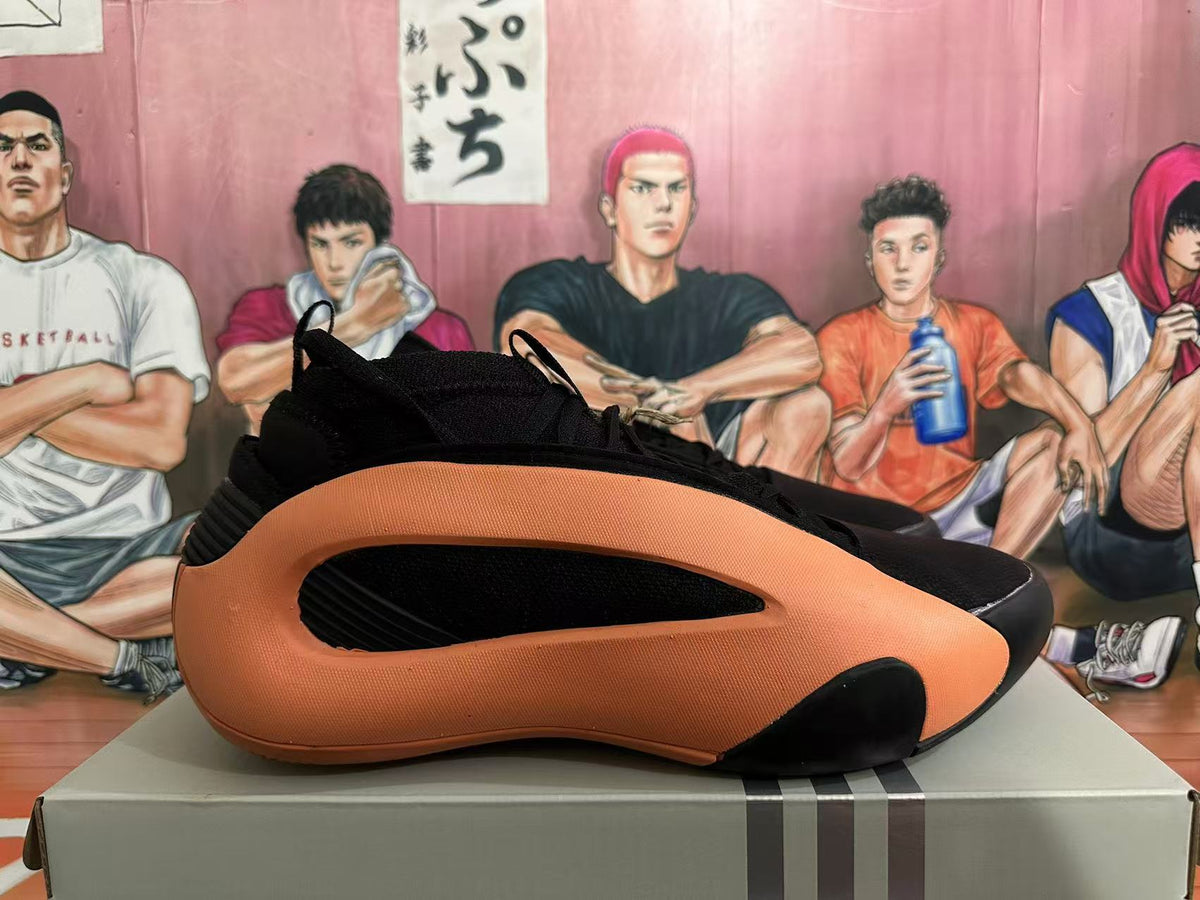 Basketball Sneakers in Black and Orange - product image from the listing.