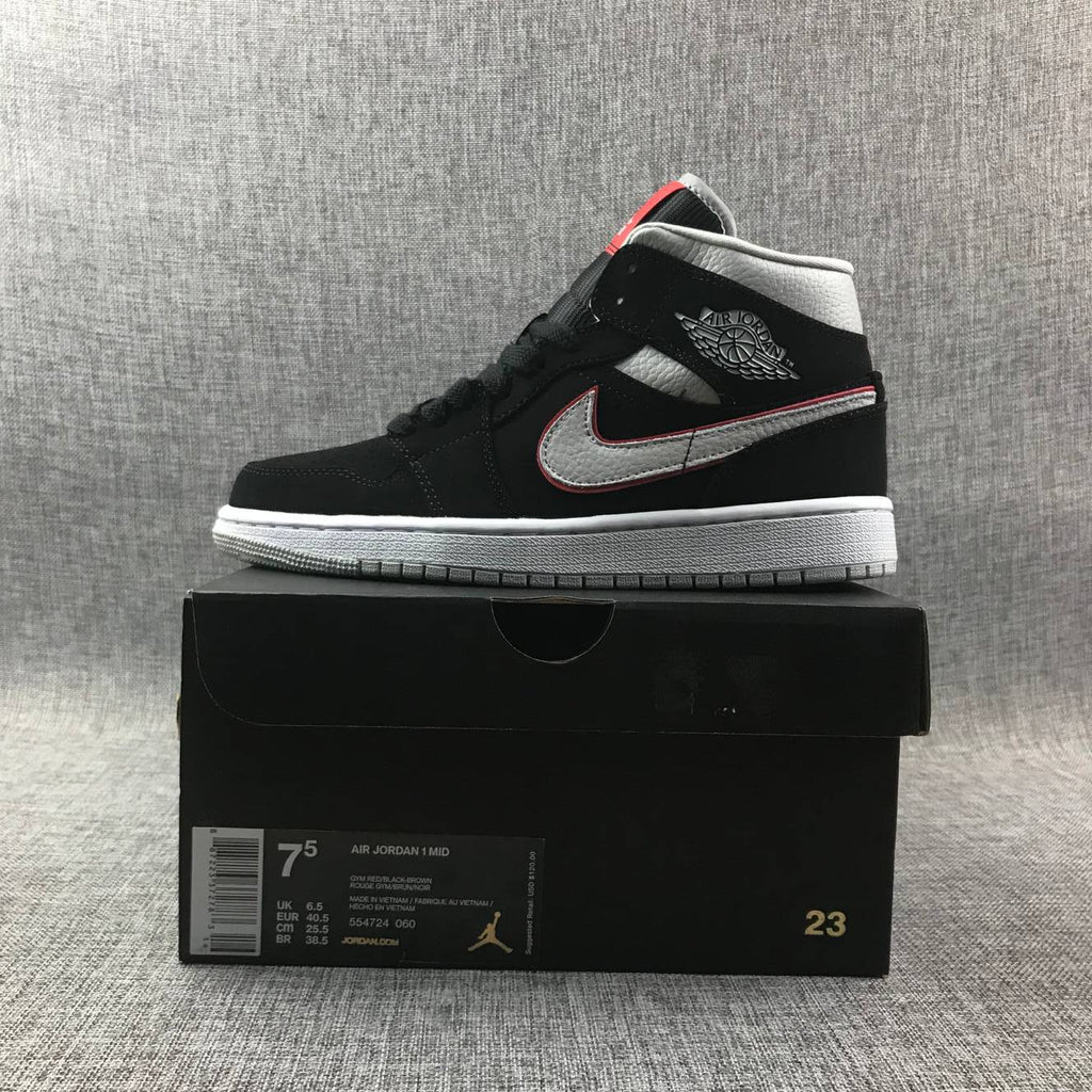 Air Jordan 1 Mid Black, Sneakers in White & Red 554724-060 - product image from the listing.