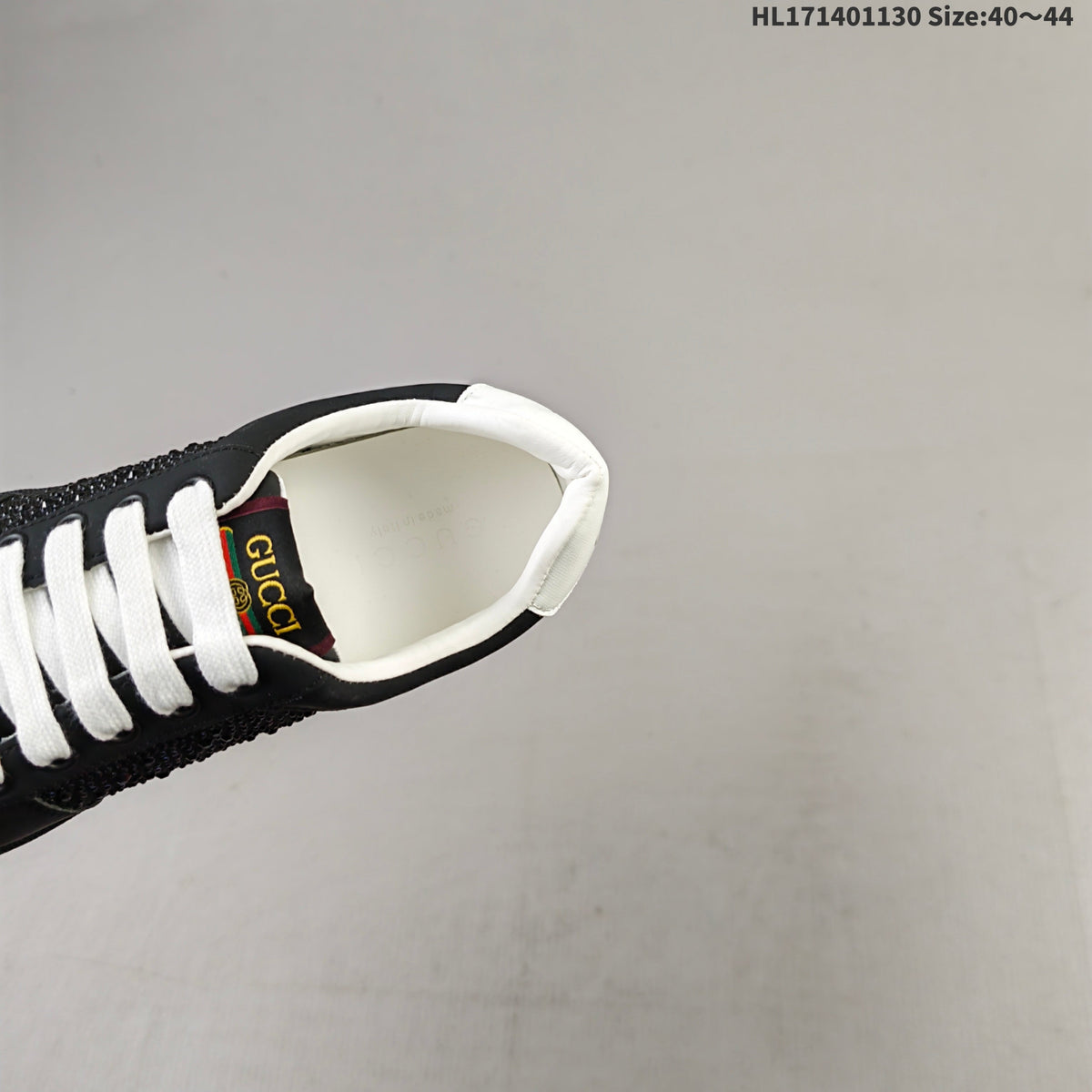 Gucci Screener Distressed Low-Top Sneakers in Black and White HL171401130 - product image from the listing.