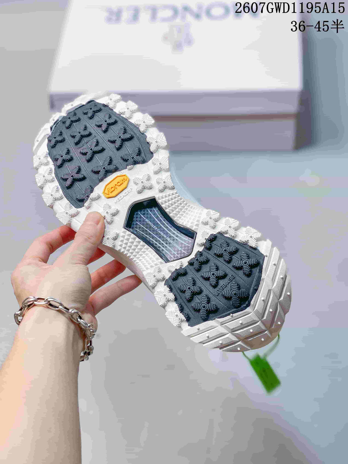 Moncler Trailgrip Lite2 Sneakers in White Black 2607GWD1195A15 - product image from the listing.