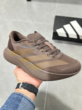 Brown and Tan Adidas Lightstrike Pro Running Shoes - product image from the listing.