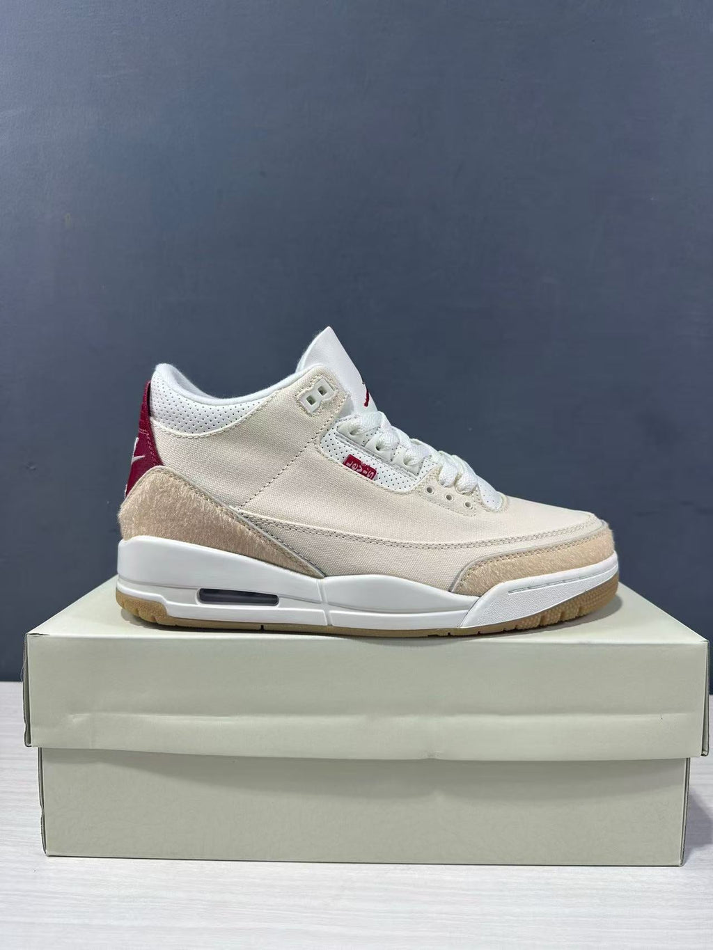Air Jordan 3 Retro Jumpman Year of the Horse Sneakers Cream Red IR0910-400 - product image from the listing.