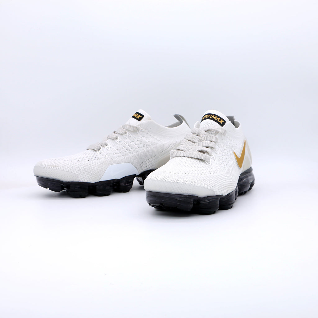 Nike Air VaporMax Flyknit Sneakers in White Gold Black 942842-010 - product image from the listing.