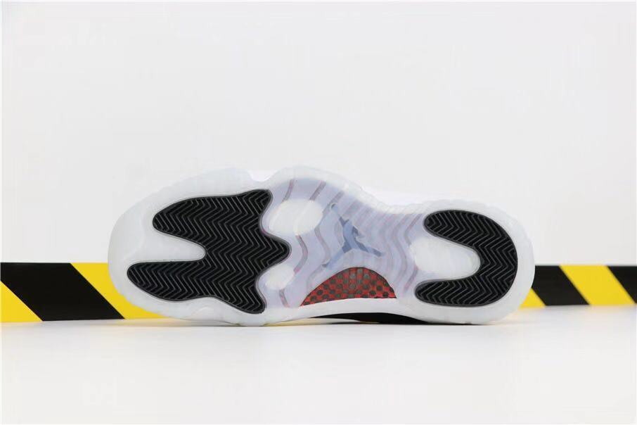 Air Jordan 11 Retro 72-10 High-Top Sneakers in Black and White - product image from the listing.