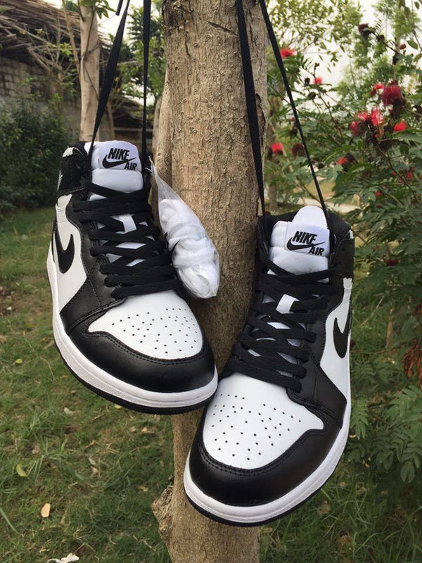 Jordan 1 High Sneakers in Black and White - product image from the listing.