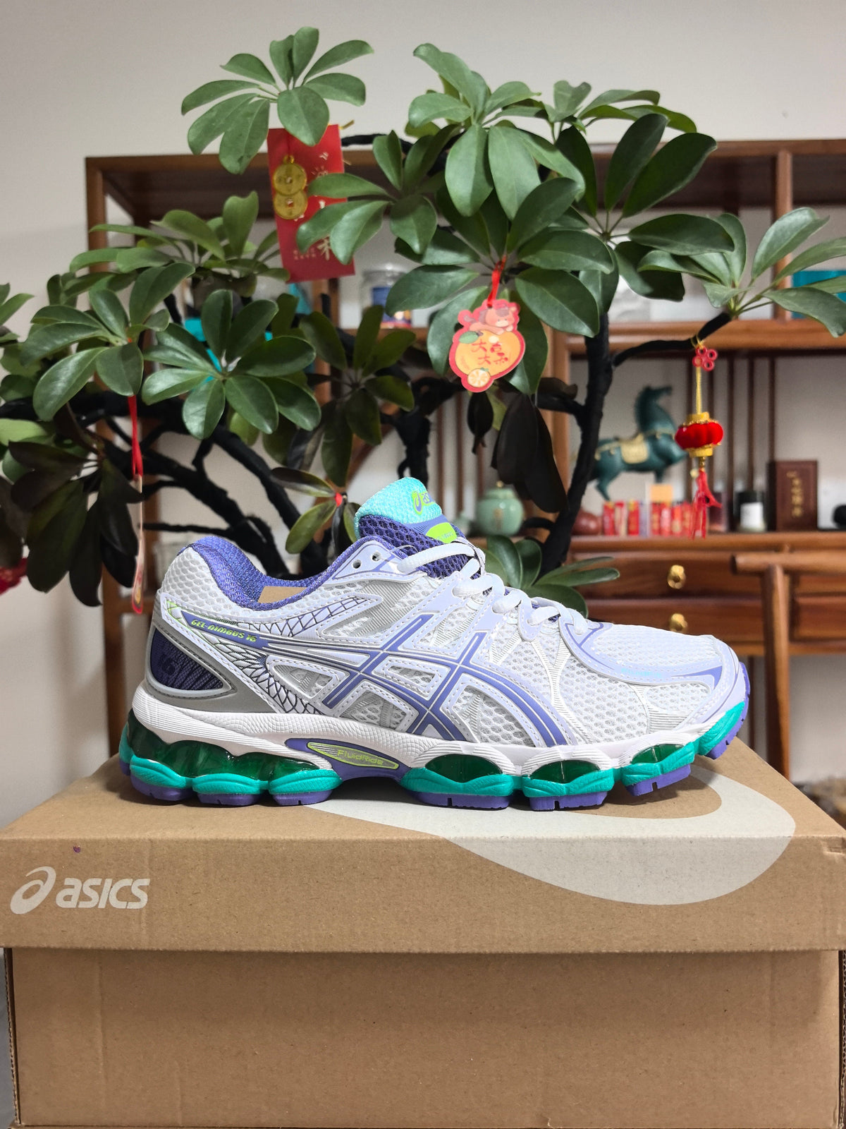Blue and Purple ASICS GEL-NIMBUS 16 Sneakers - product image from the listing.
