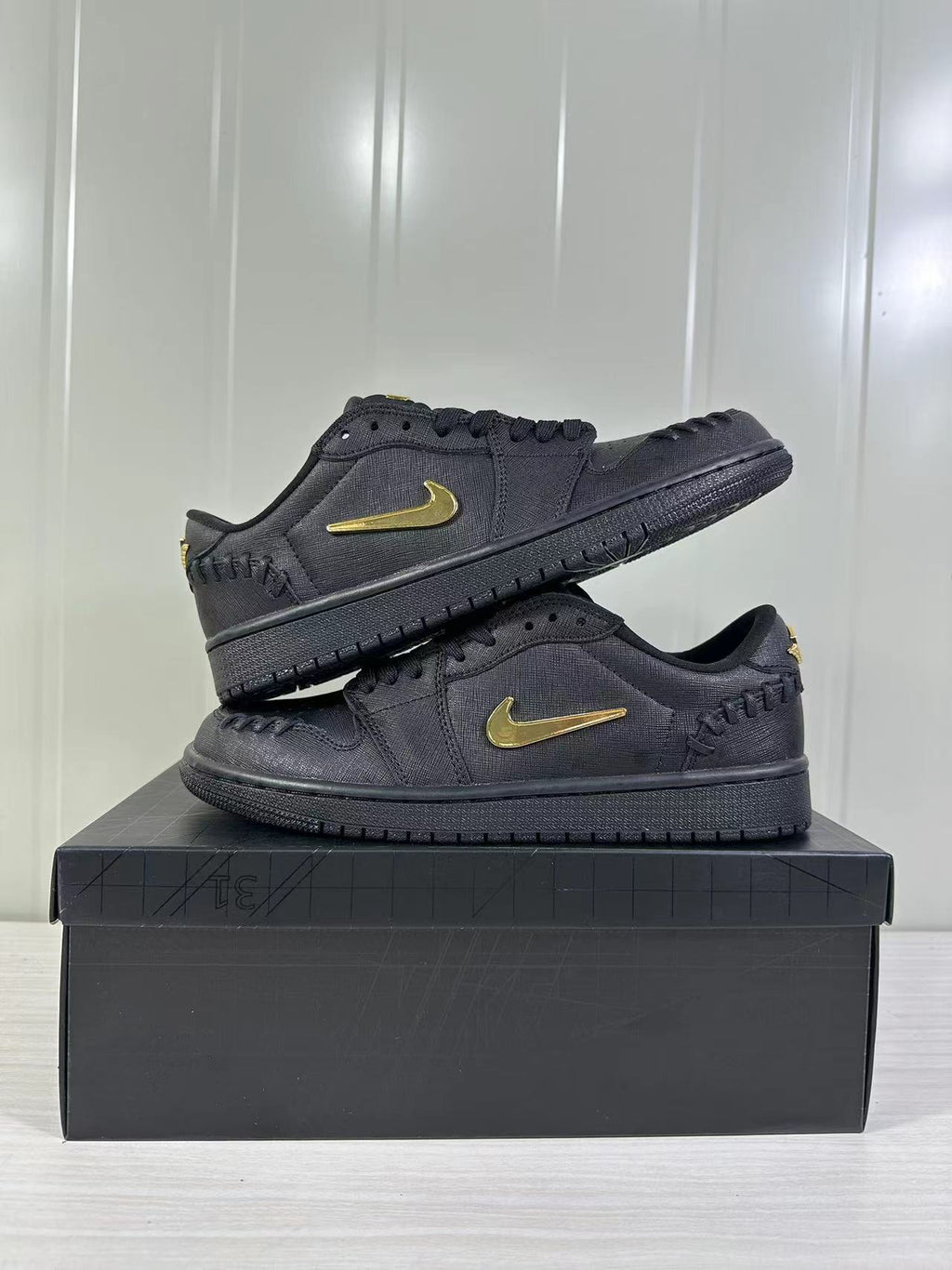 Air Jordan 1 Low Sneakers Black/Gold FN5032-007 - product image from the listing.