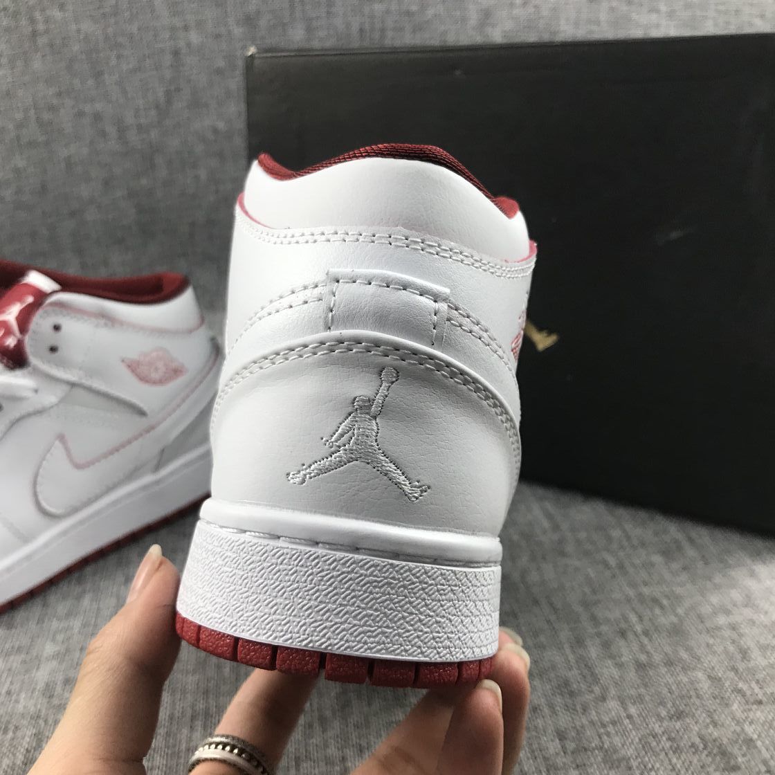 Air Jordan 1 Mid Sneakers in White and Red 554725-103 - product image from the listing.