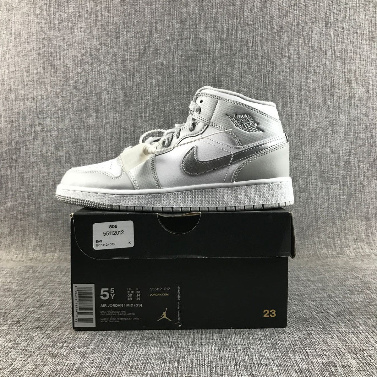 Air Jordan 1 Mid GS White and Silver Sneakers - product image from the listing.