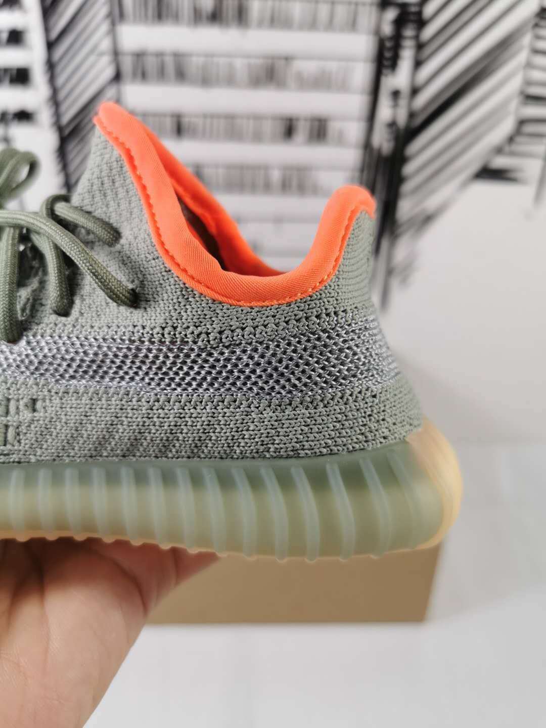Grey and Orange Yeezy 350 V2 Kids Sneakers - product image from the listing.