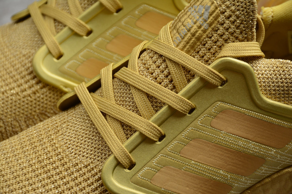 Adidas UltraBOOST 20 Consortium 6.0 Running Shoes in Gold FY3448 - product image from the listing.