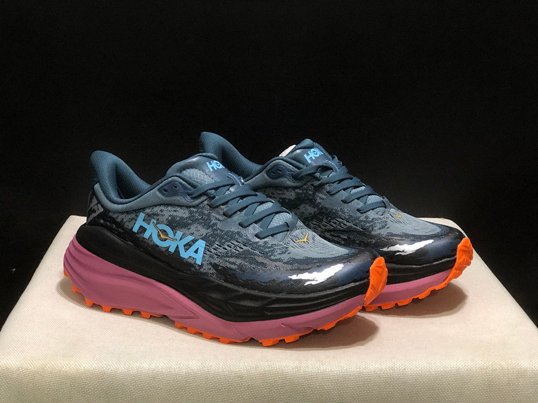 Blue and Orange HOKA Stinson 7 Trail Running Shoes - product image from the listing.