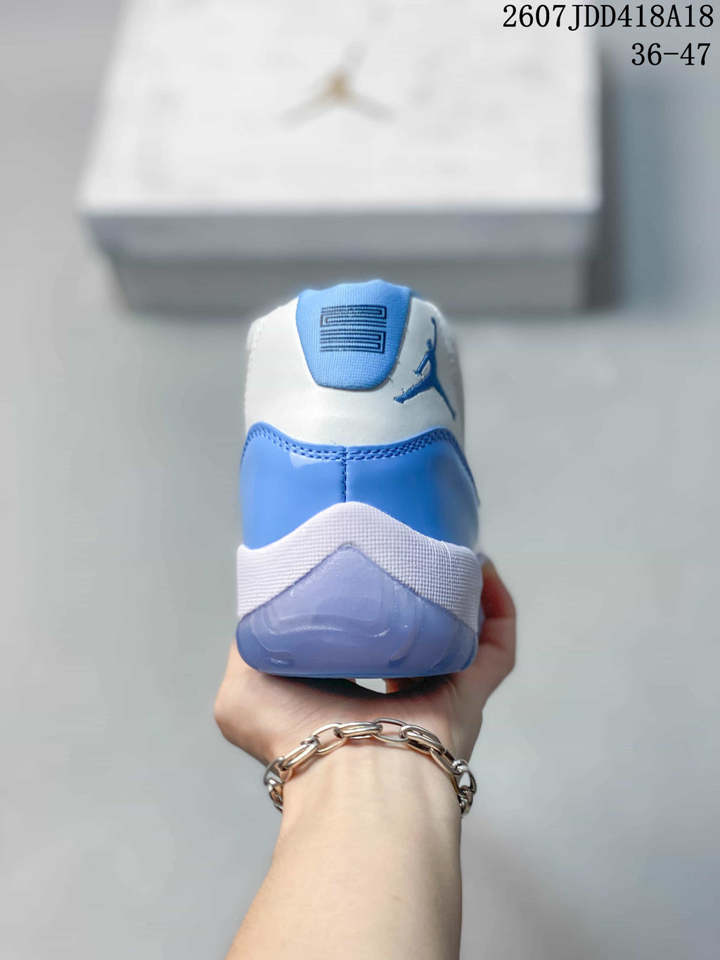 Air Jordan 11 Retro High-Top Sneakers Blue and White - product image from the listing.