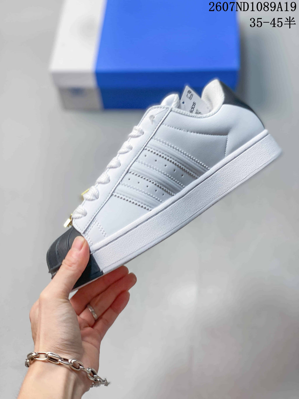 Adidas Superstar Sneakers in White Black Gold 2607ND1089A19 - product image from the listing.