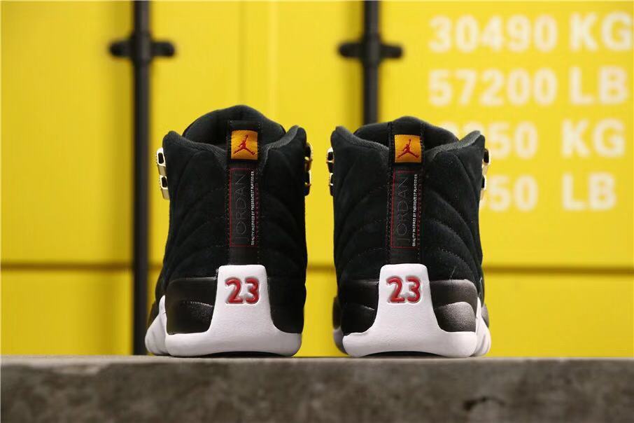 Air Jordan 12 Reverse Taxi Sneakers Black 153265-017 - product image from the listing.