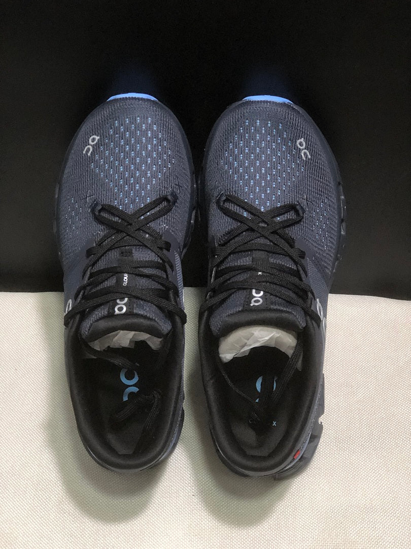 On Cloud X 4 Running Sneakers in Navy - product image from the listing.