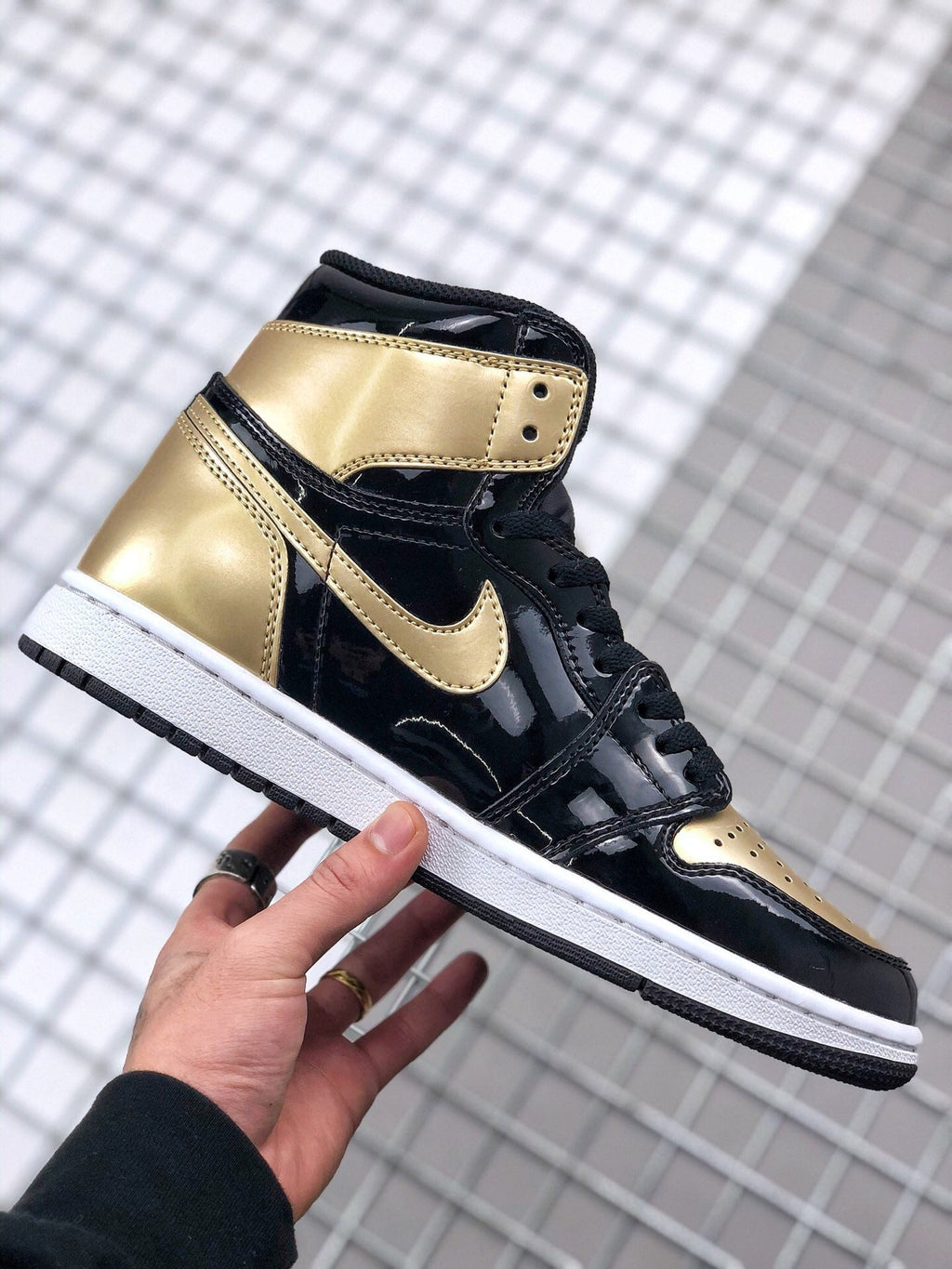 Air Jordan 1 High Gold Toe Sneakers in Black and Gold - product image from the listing.
