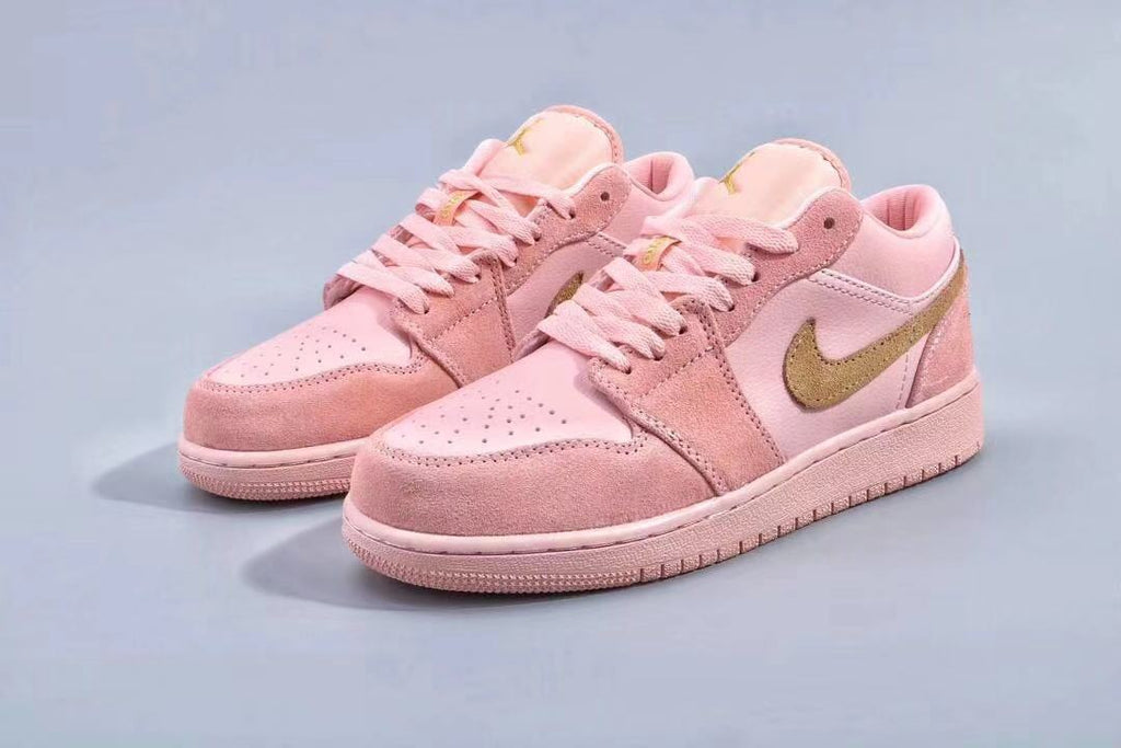 Women's Jordan 1 Low Pink and Gold Sneakers - product image from the listing.