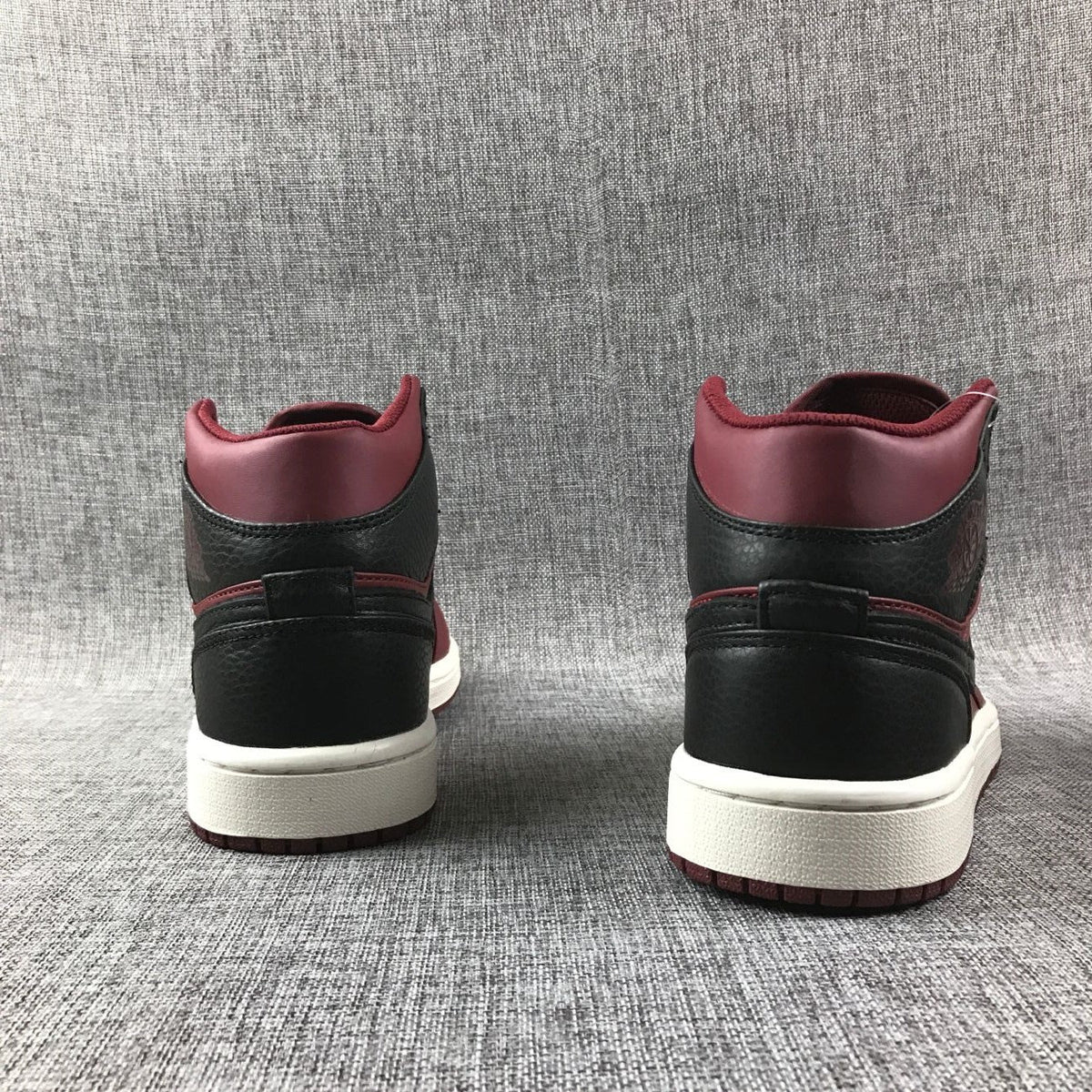 Air Jordan 1 Mid High-Top Sneakers in Burgundy and Black - product image from the listing.