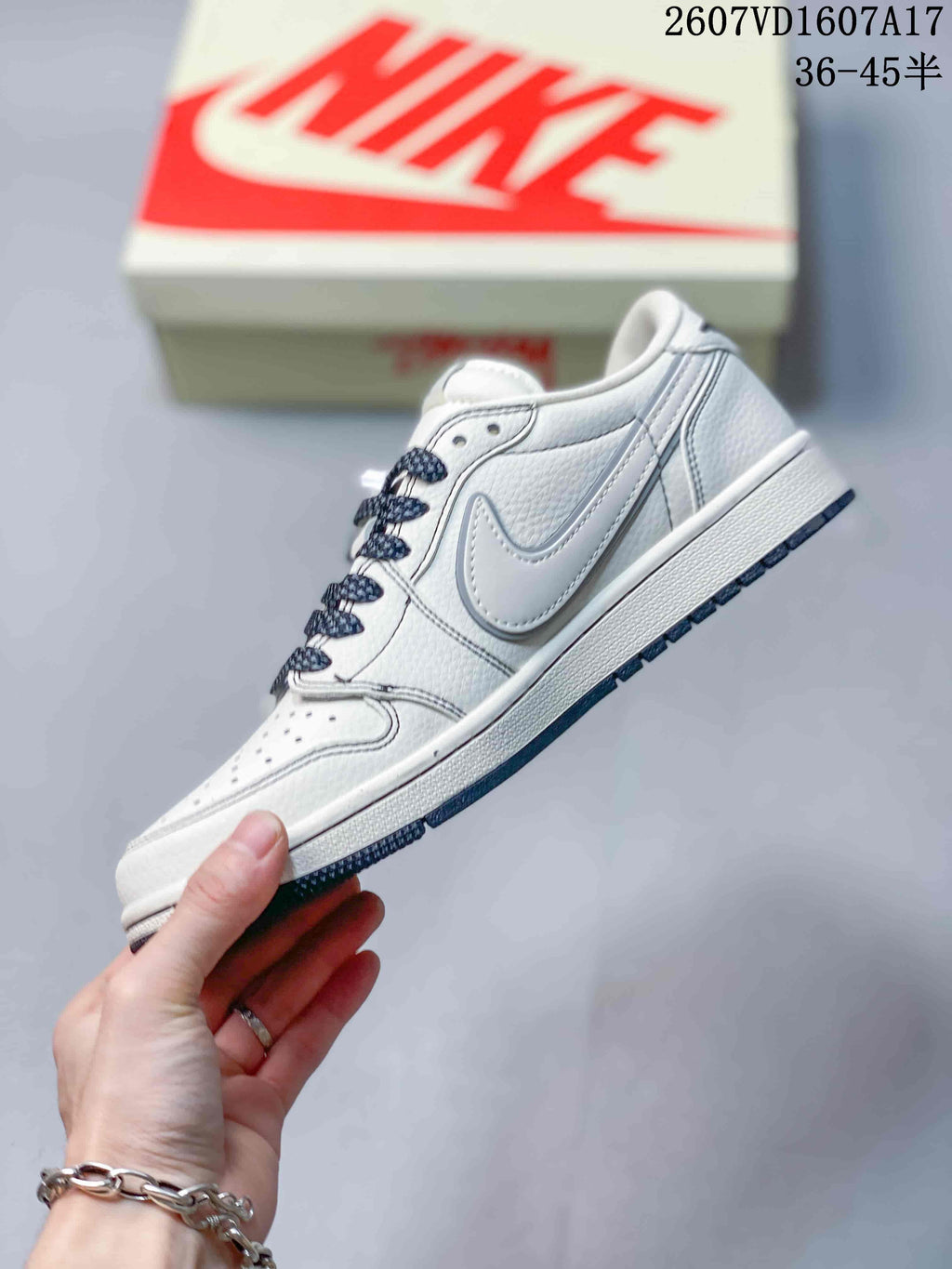 Jordan 1 Low Travis Scott x Stussy Sneakers in White Gray - product image from the listing.