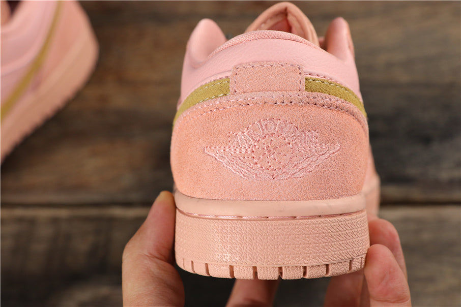 Air Jordan 1 Low Sneakers in Coral Pink CJ9216-676 - product image from the listing.
