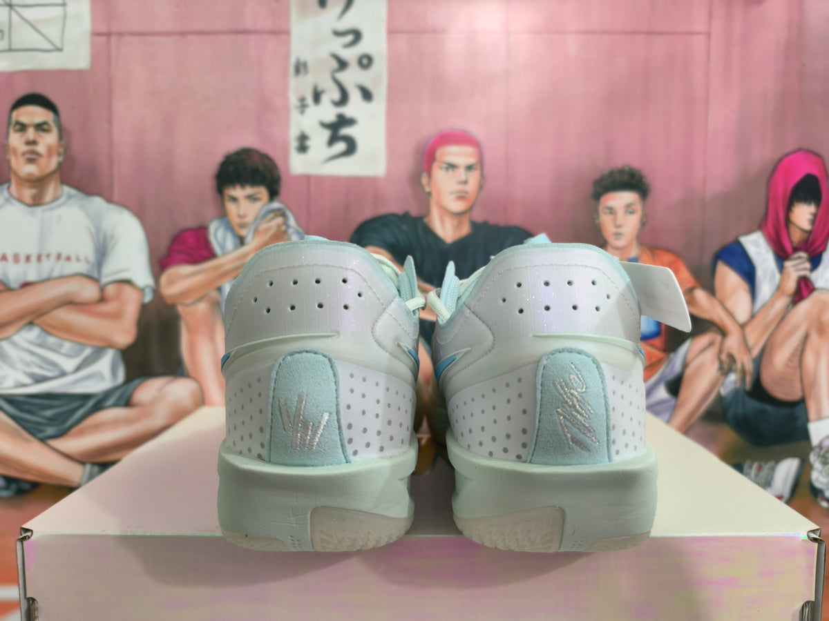 Light Gray and Blue Nike Basketball Shoes - product image from the listing.
