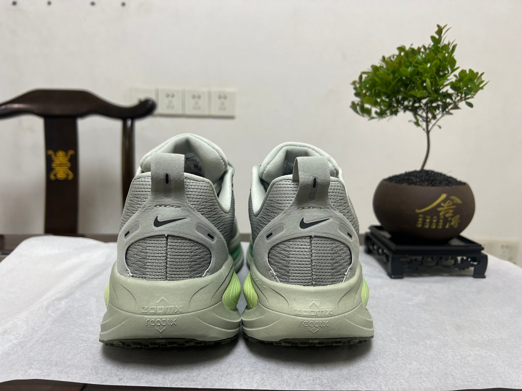 Nike Vomero 18 Running Shoes, in Gray and Volt - product image from the listing.