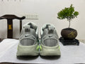 Nike Vomero 18 Running Shoes, in Gray and Volt - product image from the listing.