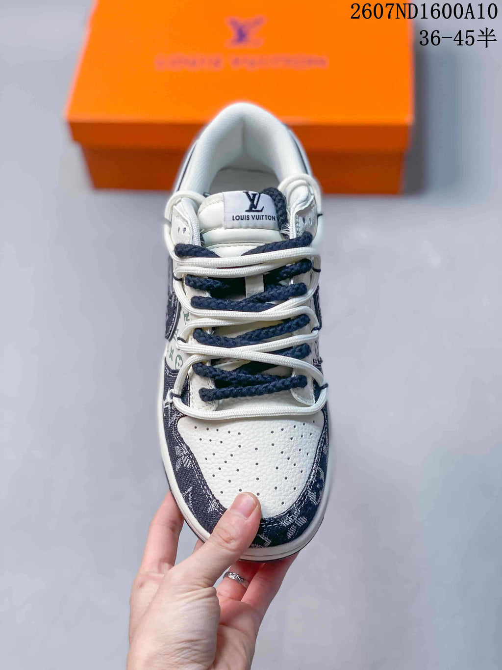 Nike SB Dunk Low Low-Top Sneakers in White and Navy - product image from the listing.