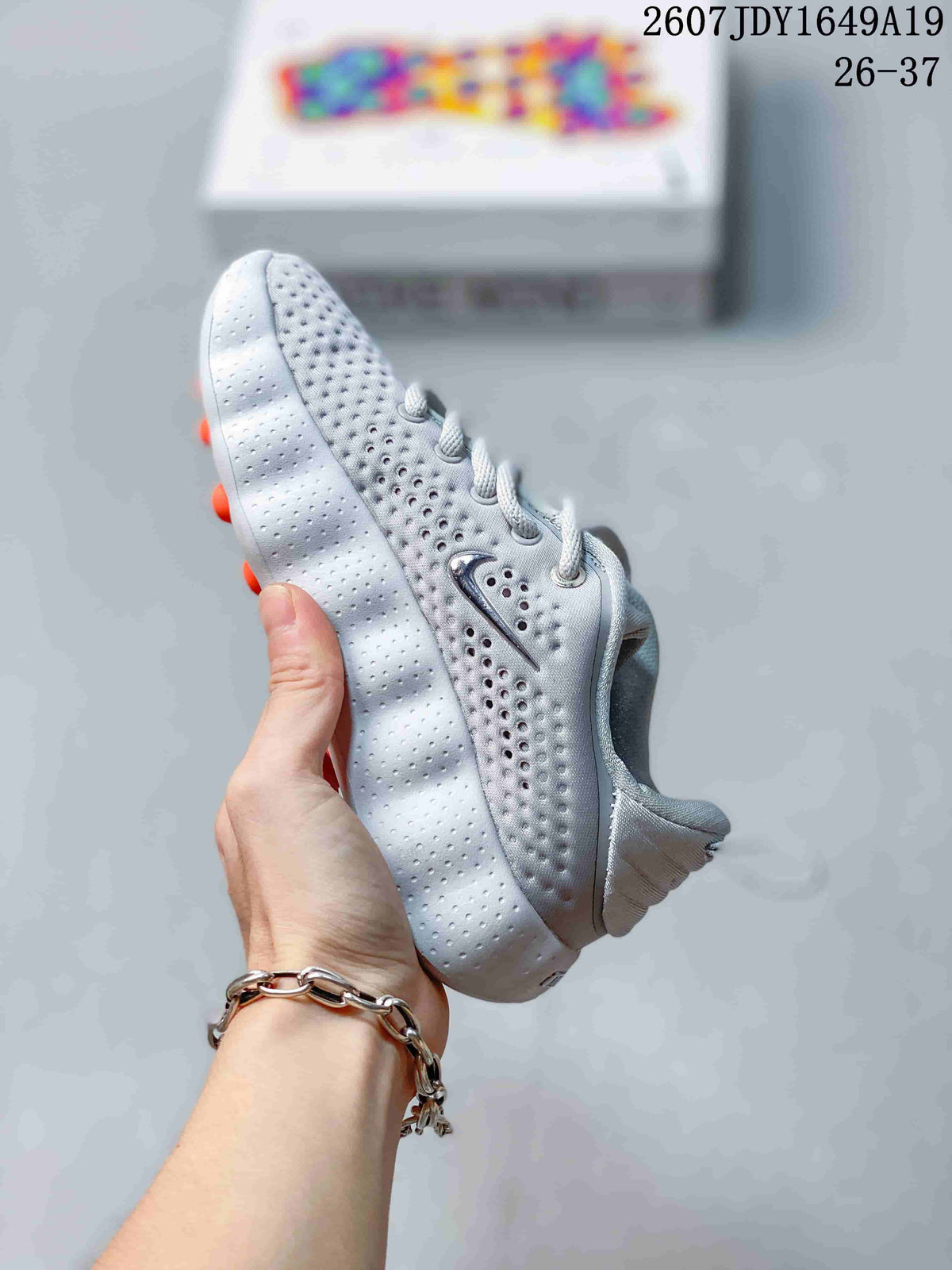 Nike Mind 002 Kids' Sneakers in White and Grey - product image from the listing.
