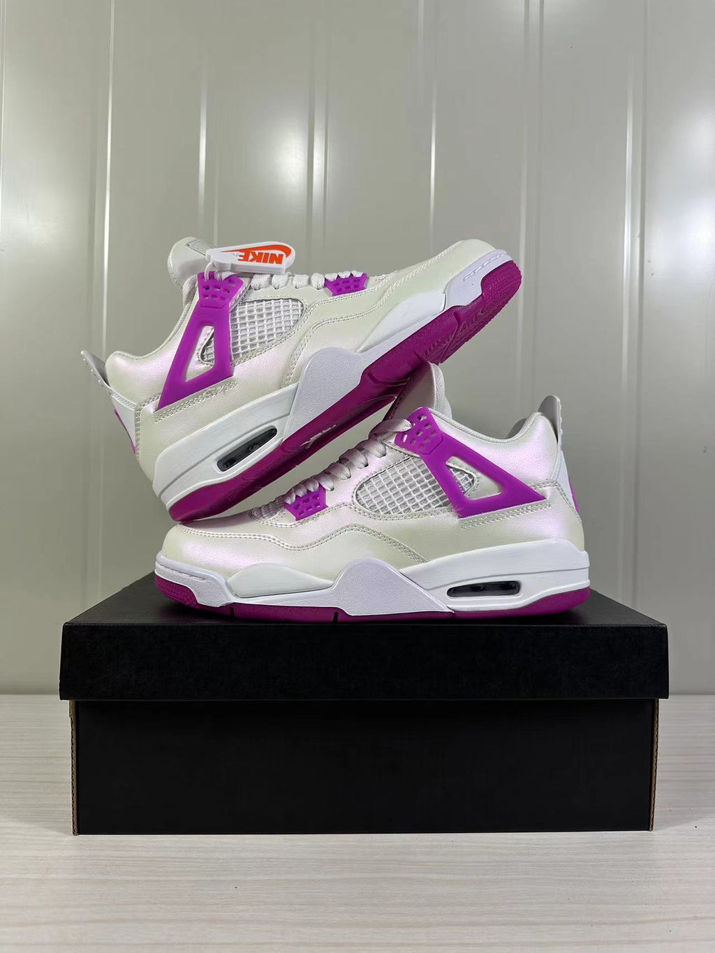 Air Jordan 4 Retro Hyper Violet Sneakers FQ1314-151 - product image from the listing.