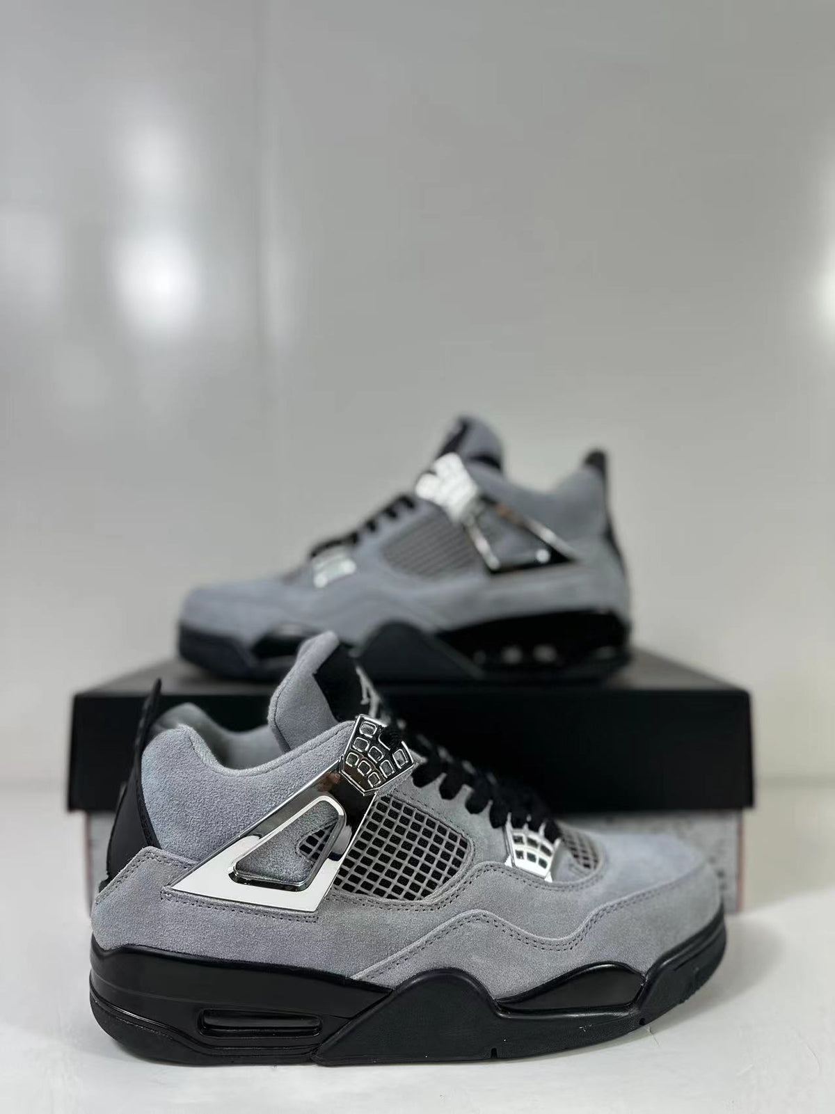 Air Jordan 4 Retro Gray Black Sneakers AQ9129-005 - product image from the listing.