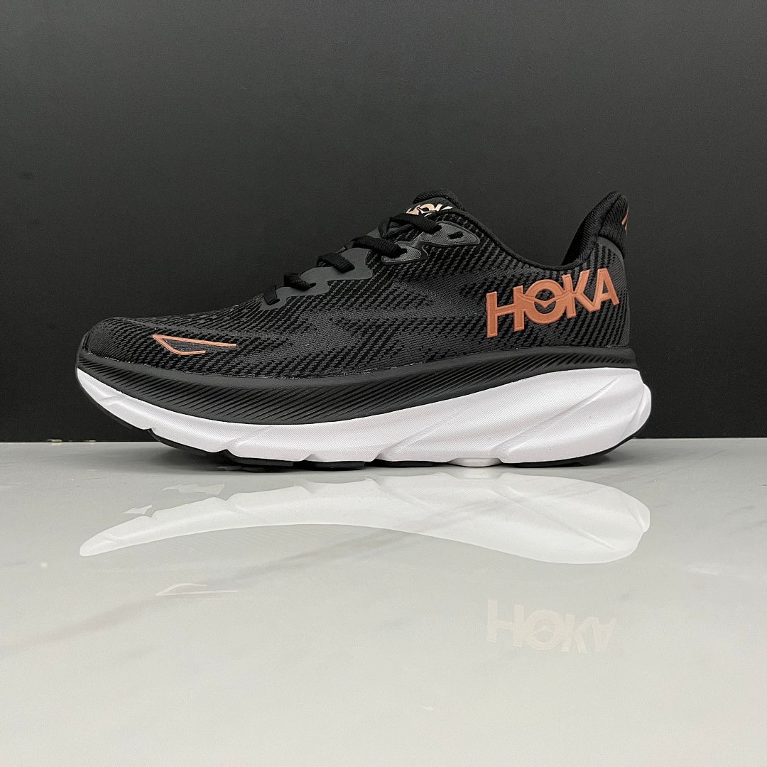 HOKA Clifton 9 Running Shoes in Black and Gold - product image from the listing.