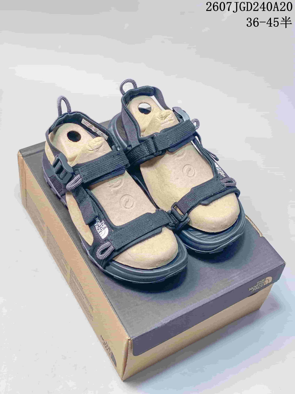 The North Face Explore Camp Sandals in Black and Tan JGD240A20 - product image from the listing.
