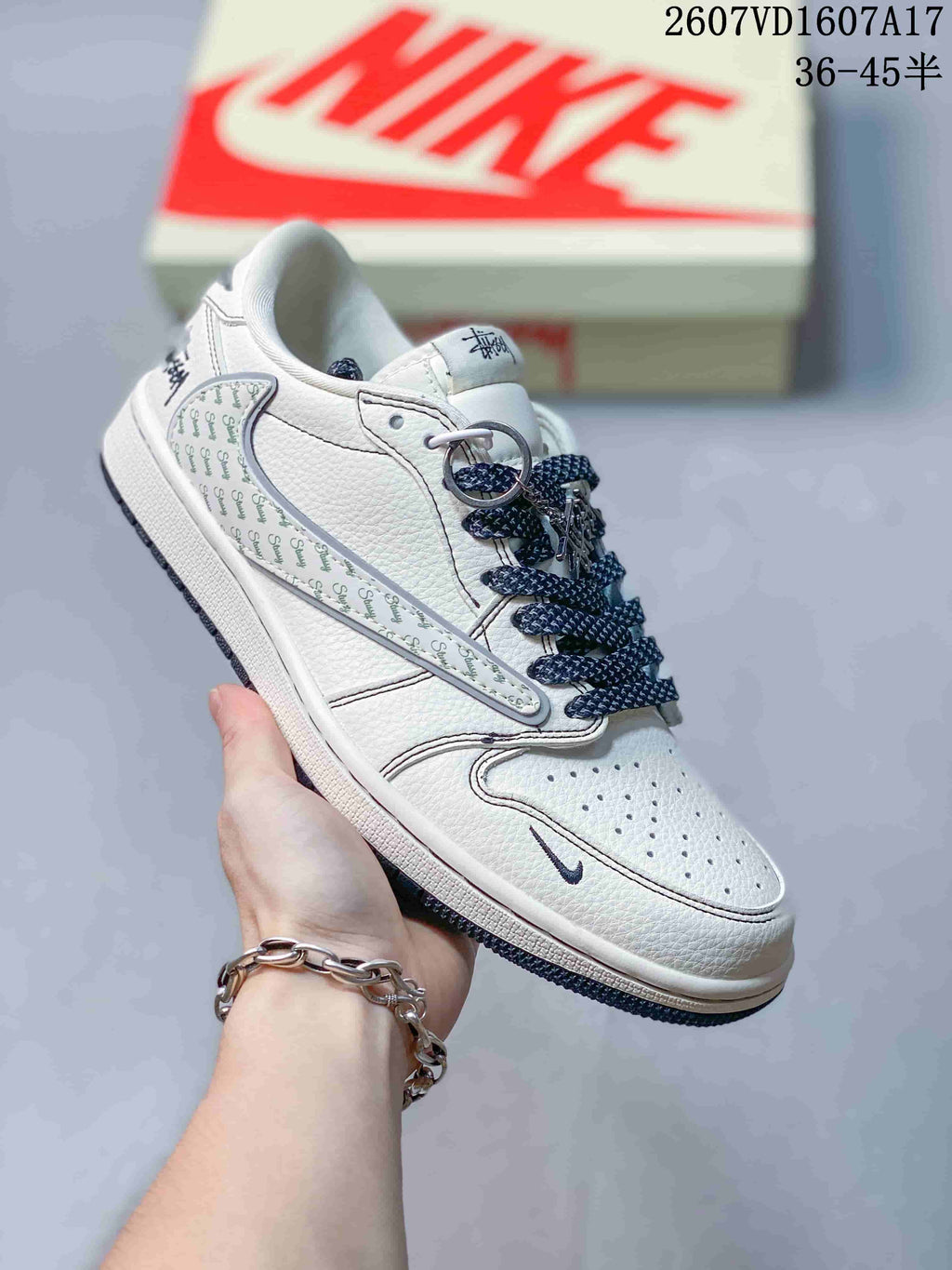 Jordan 1 Low Travis Scott x Stussy Sneakers in White Gray - product image from the listing.