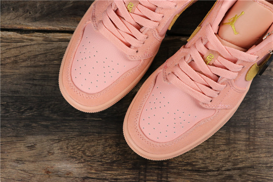 Air Jordan 1 Low Sneakers in Coral Pink CJ9216-676 - product image from the listing.