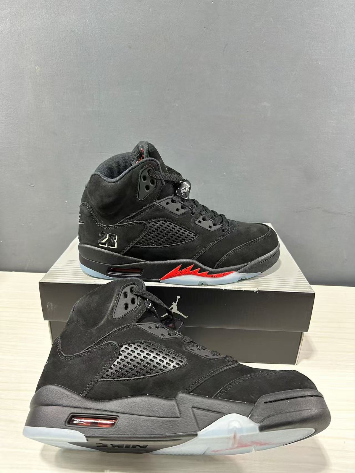 Air Jordan 5 Retro Sneakers Black and Red - product image from the listing.