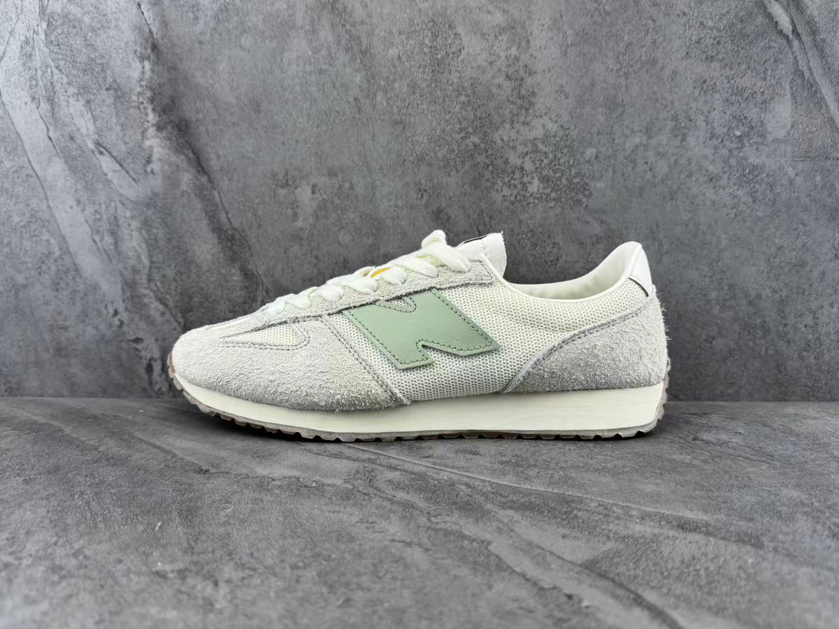 Cream and Light Gray New Balance Low-Top Sneakers - product image from the listing.