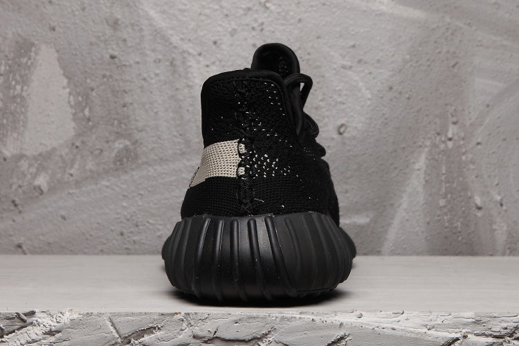Yeezy 350 V2 Sneakers in Black and Cream - product image from the listing.