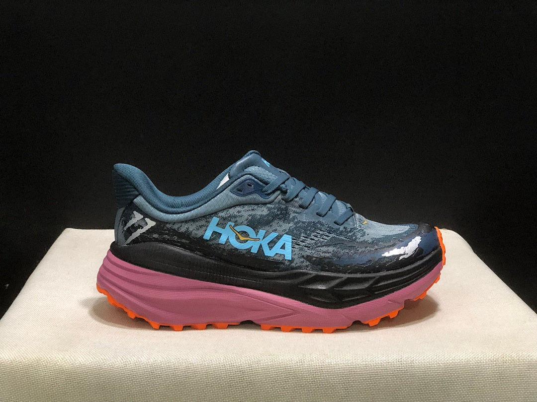 Blue and Orange HOKA Stinson 7 Trail Running Shoes - product image from the listing.