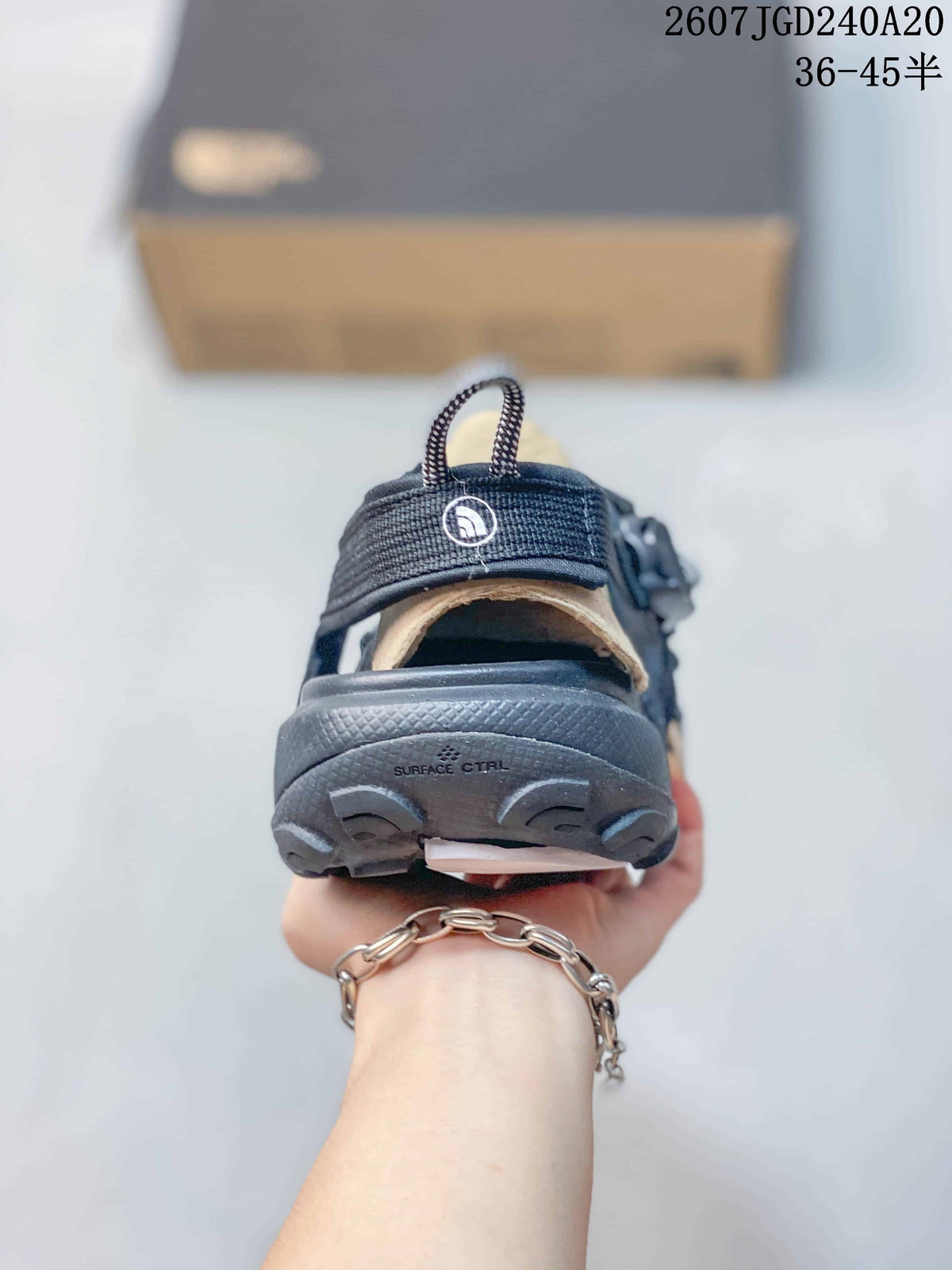 The North Face Explore Camp Sandals in Black and Tan JGD240A20 - product image from the listing.
