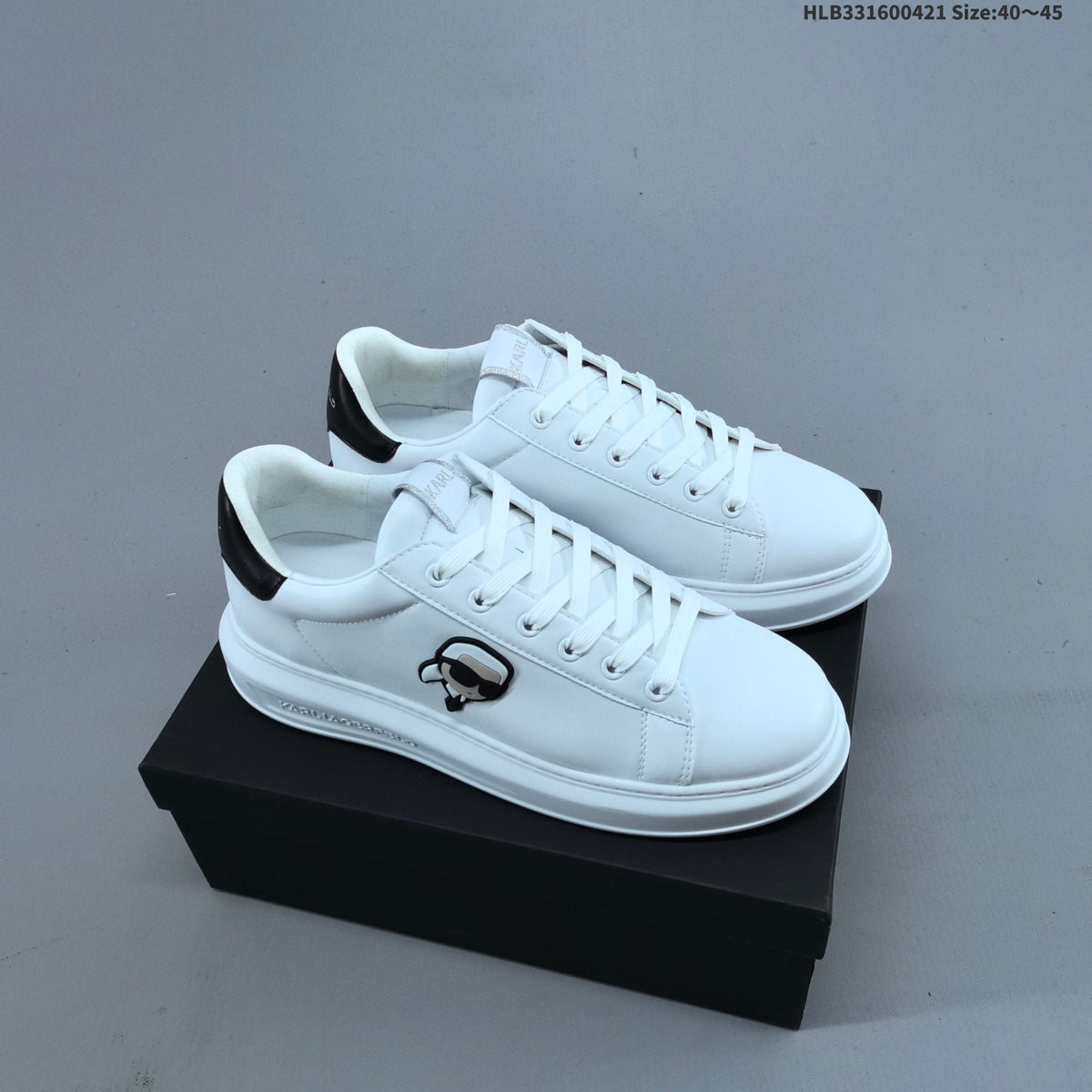 Karl Lagerfeld White Low-Cut Sneakers with Logo Detail - product image from the listing.