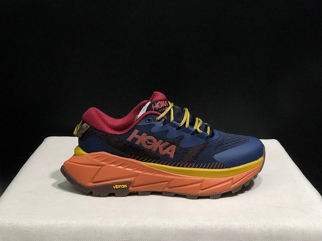 HOKA Skyline Float X Trail Sneakers in Navy Orange - product image from the listing.