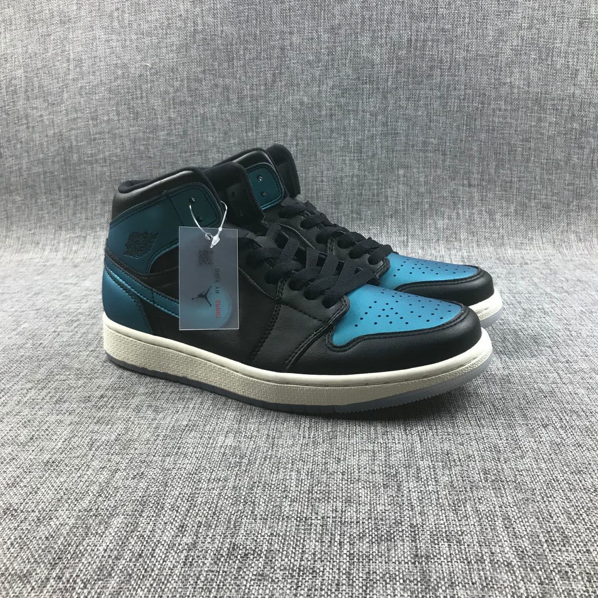Air Jordan 1 Mid BQ6472-009 Sneakers in Black and Turquoise - product image from the listing.